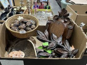 A box of carved treen with a basket of shells.