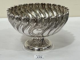 A Victorian wrythen fluted footed bowl, chased with foliage. Sheffield 1888. 9½" diam, 22ozs, 15