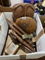 An early 20th century book stand; carved wood bird plaque; Regency bronze curtain tie and other