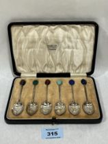 A cased George V set of six silver coffee spoons with hardstone bean finials. Birmingham 1923.