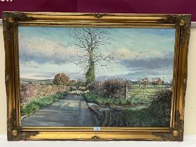 RON HUMPHRIES. BRITISH CONTEMPORARY. A country lane with figure and sheep. Signed. Oil on canvas 24"