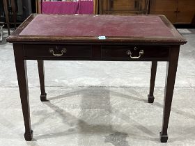 An early 20th Century mahogany writing table with inlaid top and two frieze drawers. 42" wide.
