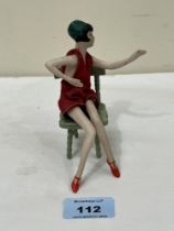 A 1920s bisque porcelain "boudoir lady" flapper doll with jointed limbs. 6" high approx. The lot