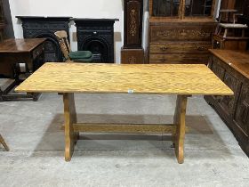 An oak refectory style dining table. 62" long.