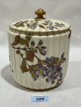 A Royal Worcester blush ivory fluted jar and cover. 7" high. Shape 1282.