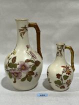 Two Royal Worcester jugs, gilded and painted with flowers. 10" high and smaller.