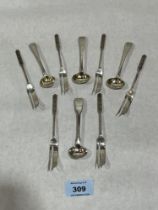 A set of six silver cake forks by Liberty & Co and four Georgian silver salt spoons. 4ozs.