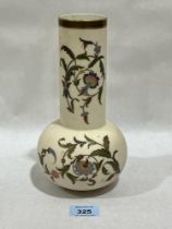 A Royal Worcester blush ivory vase, gilded and painted with trailing foliage. 9" high.