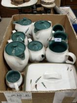 A box of Denby ceramics.