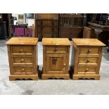 A pair of pine bedside chests and a pine bedside cabinet.