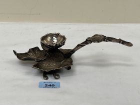 A 19th Century plated leaf form chamberstick. 9½" long.