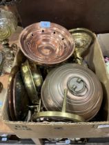 A box of brass and copperware.