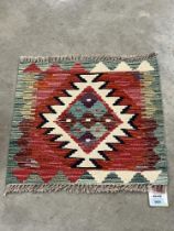 A Chobi Kilim rug. 0.44m x 0.48m.