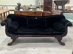 A Regency rosewood sofa with swan neck arms on outswept carved paw legs. 84" wide.