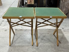 A pair of folding bridge tables.