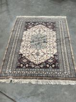 An Eastern rug of finely knotted weave. 65" x 49½".