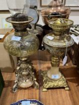 Two brass oil lamps.