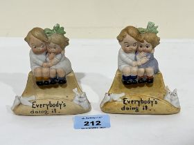 A pair of early 20th Century bisque figural pen stands. 3½" high.