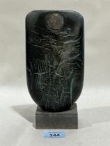 Peter Hayes. British Contemporary. Black Raku Bow with copper disc. Signed and dated '03. 8½" high.