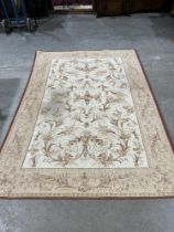 An Aubusson style carpet. 94" x 65".