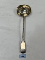 A George III silver fiddle pattern soup ladle. London 1815. 13" long. 5ozs 19dwts.