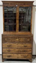 A Victorian mahogany inlaid and banded secretaire bookcase, enclosed by a pair of astragal glazed