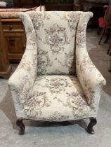 A 1920s wing armchair.