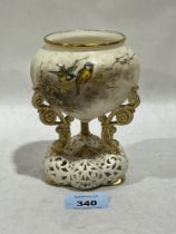 A Grainger & Co Worcester bowl on tripod scrolled support and reticulated base. 5½" high.