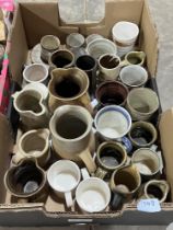 Two boxes of studio pottery.