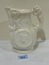 A Staffordshire white glazed royal commemorative jug, 7½" high. Base cracked.