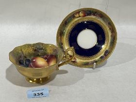 A Royal Worcester cabinet cup and saucer, painted with fruit by Edward Townsend.