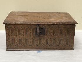 A 17th Century oak carved "Bible" box with moulded lid. 24" wide.