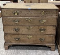 A 19th century oak chest of four long graduated drawers on bracket feet. 42" wide