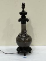 A Chinese porcelain and bronze mounted lamp. 18" high excluding fitting.