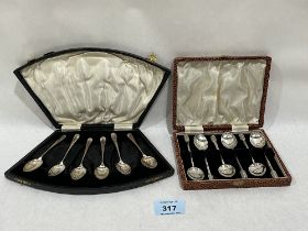 Two cased sets of six silver coffee spoons. 2ozs 12dwts.