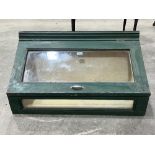 A painted display case, 32½" wide.