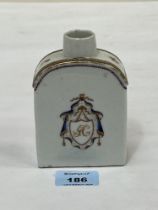 A late 18th Century Chinese export porcelain armorial tea caddy. 5" high. Hair crack to neck,