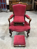 A Victorian rosewood and upholstered armchair and two Victorian footstools.