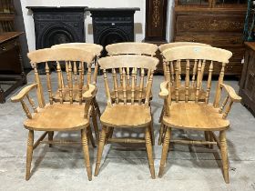 A set of six beechwood spindle back kitchen chairs.
