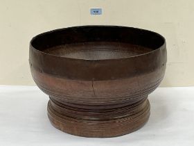 A turned treen bowl with copper mounted rim. 15½" diam.