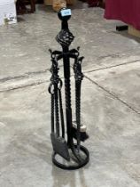 A wrought iron fireside companion set, 28" high.