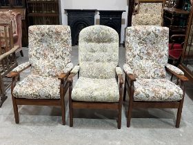 Three modern upholstered armchairs.