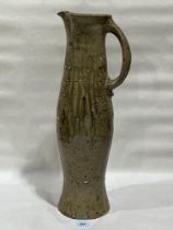 Nic Collins. Bn 1958. A glazed pottery ewer. Signed to base. 22½" high.