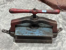 A cast iron book press.