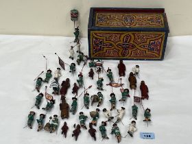 A collection of Chinese painted figures in polychrome decorated box.