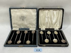 Two cased sets of six silver coffee spoons with bean finials.