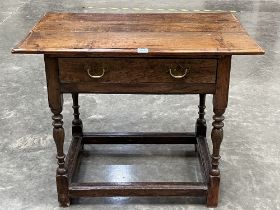 A James II and later joined oak side table, with frieze drawer, on inverted baluster turned supports