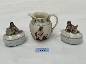 A pair of 19th Century porcelain trinket boxes and a parian relief decorated jug. 3" high.