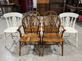 A set of four wheelback armchairs and a pair of painted chairs.