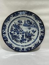A 19th Century Chinese blue and white decorated charger. 14½" diam. Glued repair.